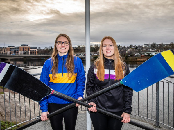 The two University Boat Club Presidents smile together at the boat house