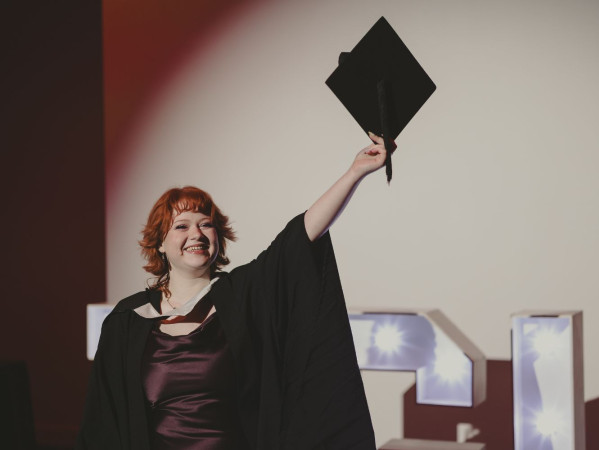 Catherine Lily Mearns, RGU graduate from Gray's holding her graduation hat at the P & J Live.