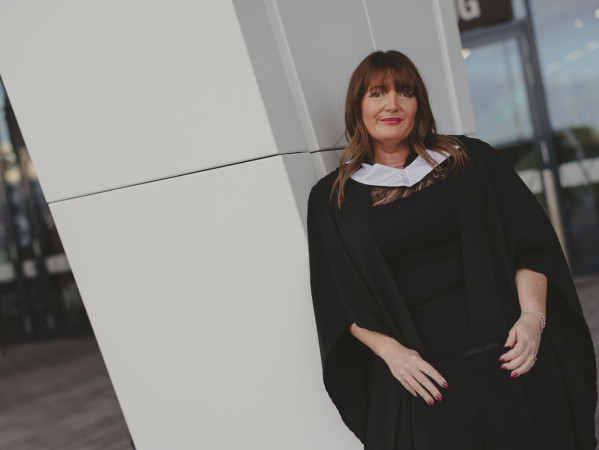 Emma Dressel smiling at graduation