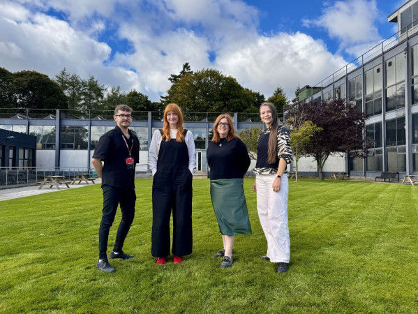 Image shows panel for Glory cabaret outside Gray's School of Art - (left to right) shows Bart Grabski, Claire Bruce from Look Again, Jennifer Louden (RGU Art & Heritage Collections) and Svetlana Panova.