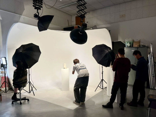 Person taking photos in a studio