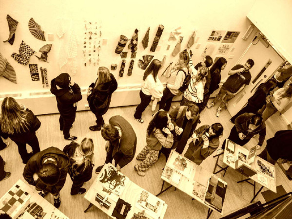 Sepia toned image of lots of people in a gallery Sepia toned image of lots of people in a gallery