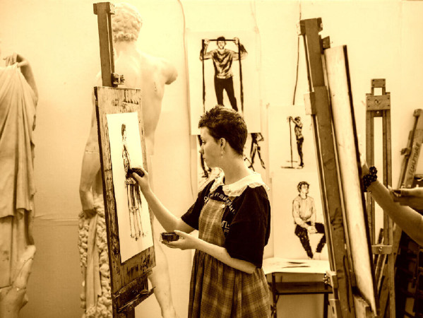Sepia toned image of a person drawing in a studio Sepia toned image of a person drawing in a studio