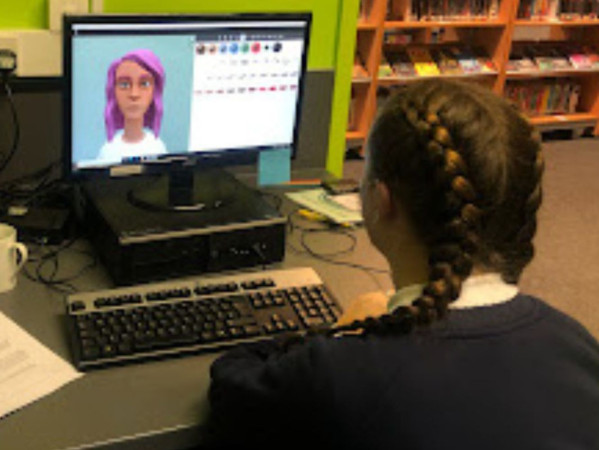 Image shows school pupil looking at a computer screen with the Maddie is Online programme