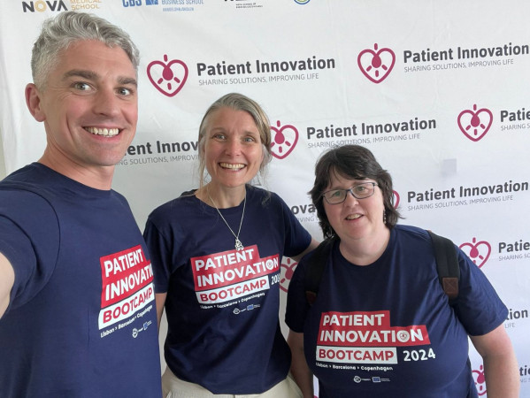 Dr Mark Holland, Dr Julie Jones and Jo Holland wearing dark blue t-shirts in front of a white background