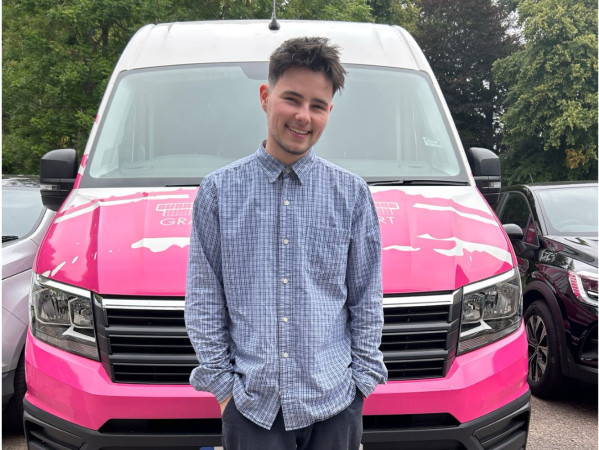 Ray Downie, Gray's Mobile Art School Co-ordinator in front of pink van