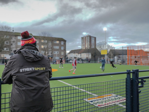 A Streetsport volunteer looks upon a session at Cruyff Court Willie Miller