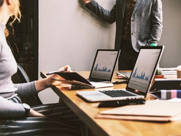 People at a meeting with laptops