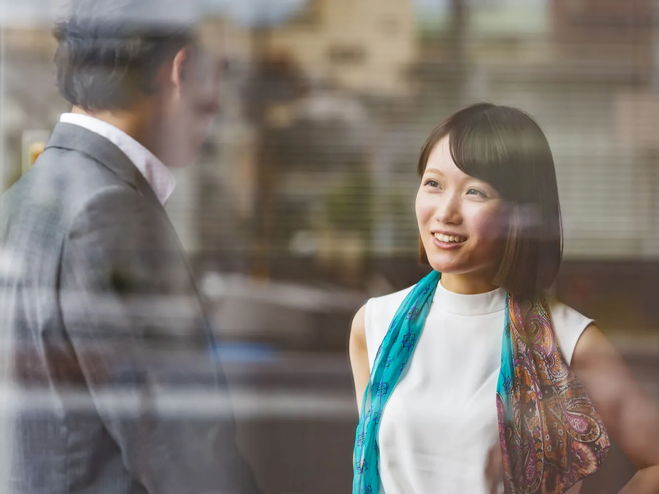 two people in business attire chatting